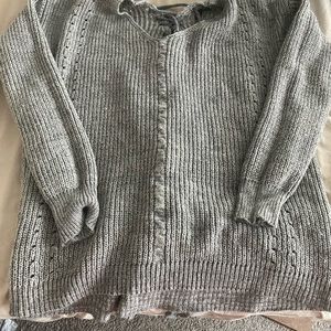 Grey knit sweater with tie up detail in the back!